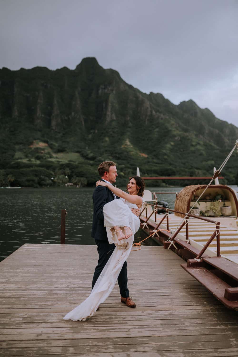Bride and groom at Kualoa Ranch Secret Island oahu hawaii.